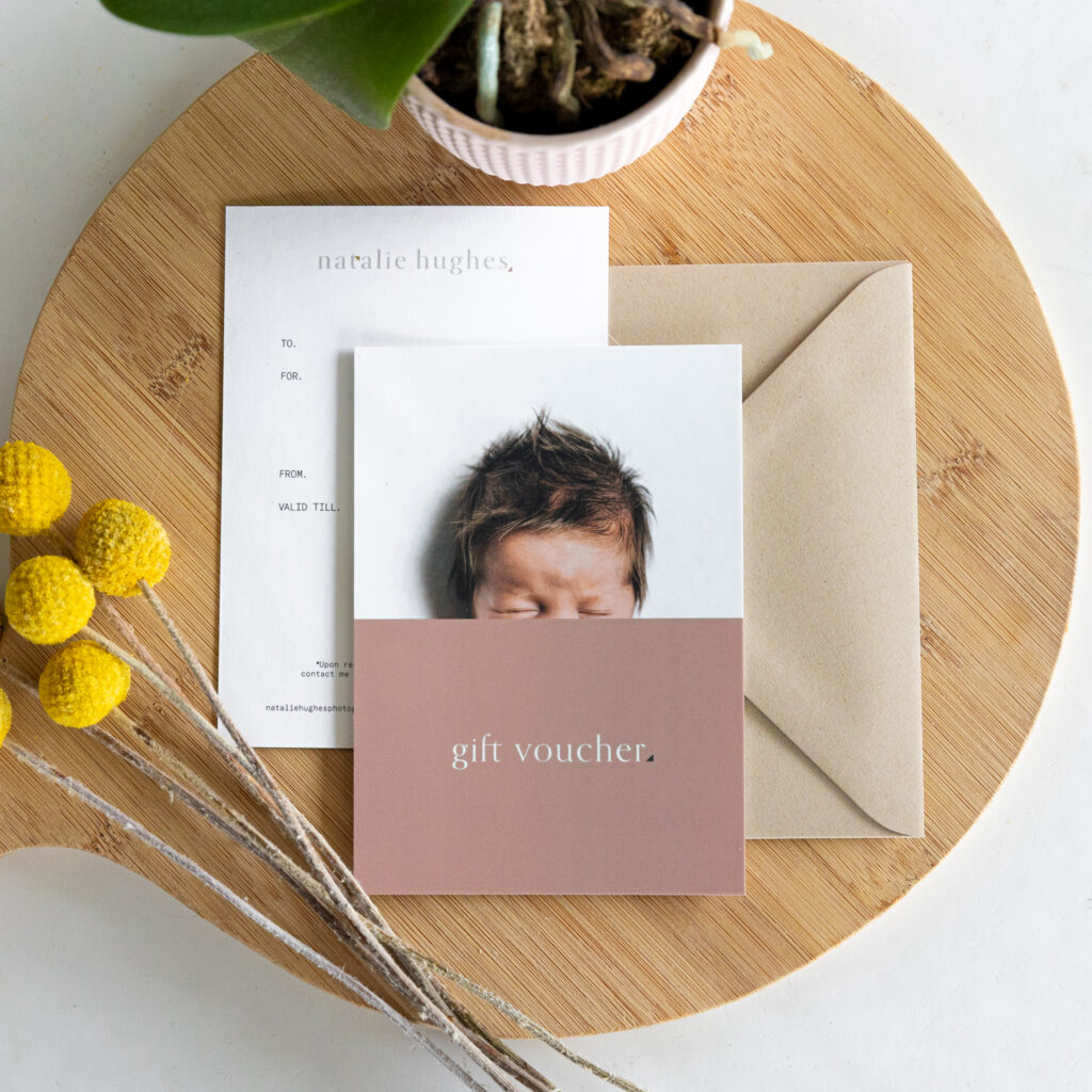 Photography gift voucher for Melbourne photographer Natalie Hughes pictured front and back along with brown envelope.