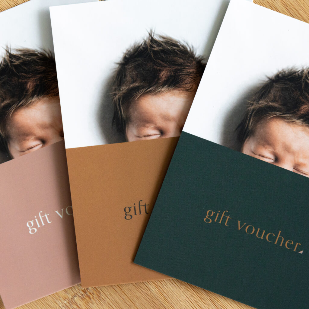 3 photography gift vouchers pictured in pink, brown and green